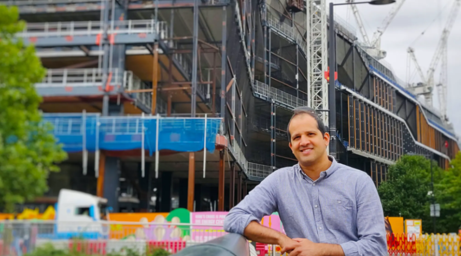 CEO standing in front of construction site