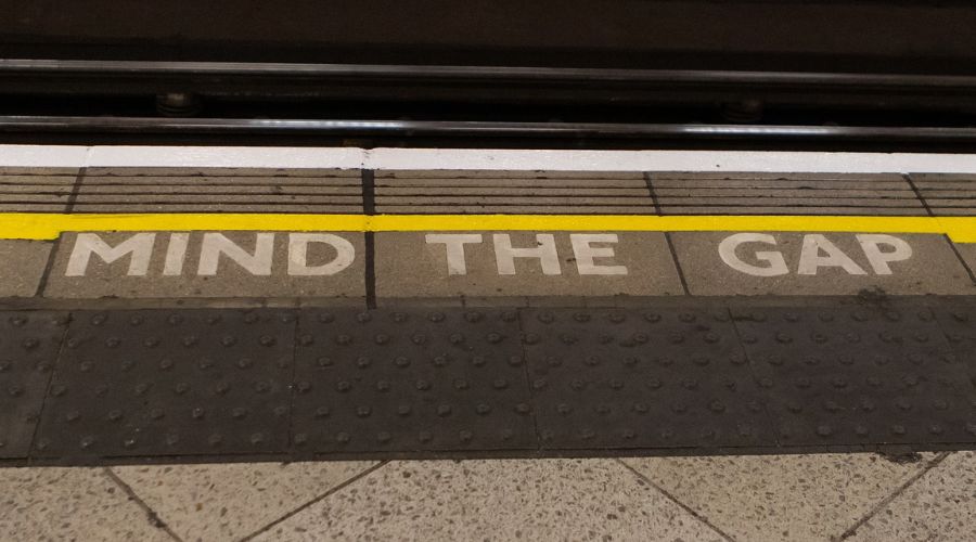 'Mind the gap' warning alongside a rail line.